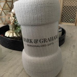 Light gray fringed throw blanket